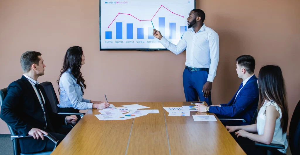 businessman-presenting-chart-meeting